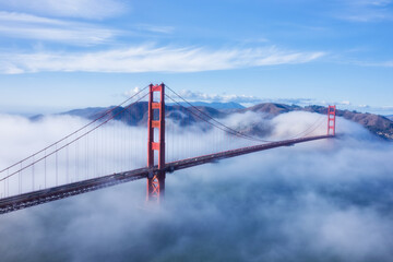 Aerial view on Golden gate bridge on a foggy day 