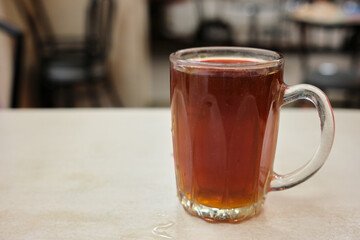 Selective focus of glass of hot tea at restaurant