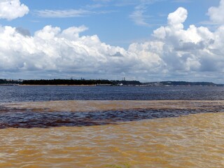 The Meeting of Waters (Portuguese: Encontro das Águas) is the confluence between the Rio Negro, a...