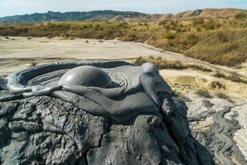 Active mud volcano eruption with a mud bubble captured in Romania