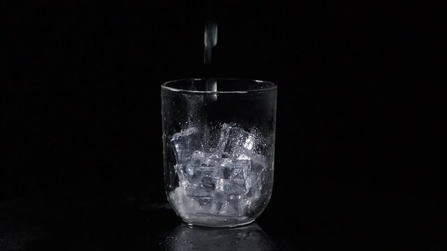 pouring delicious lemonade in glass