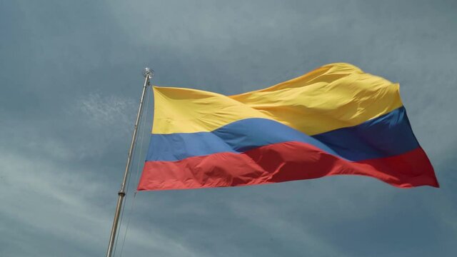 Colombian Flag On the Wind and Sunny Sky 