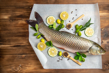 top view fresh fish with lemon slices on wooden table food seafood dish ocean