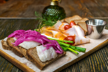 Eastern European style board with several kinds of snacks