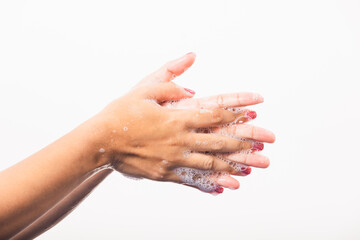 Closeup young Asian woman washing hands by soap for cleanliness and prevent germs coronavirus, studio shot isolated on white background, Healthcare medical COVID-19 virus concept