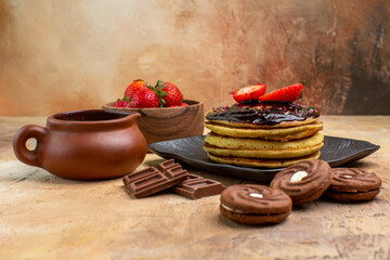 front view yummy pancakes with cookies and fruits on wooden desk dessert cake sweet pie
