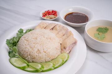 Hainanese chicken rice. Roasted Chicken Rice with soup, vegetable and Garlic, chili, ginger sauce.
