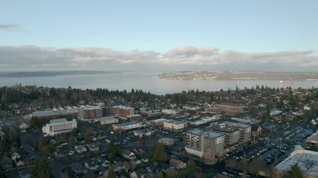 Aerial View Of Urban Landscape By The Calm River In Proctor District, Tacoma, Washington - aerial drone shot 