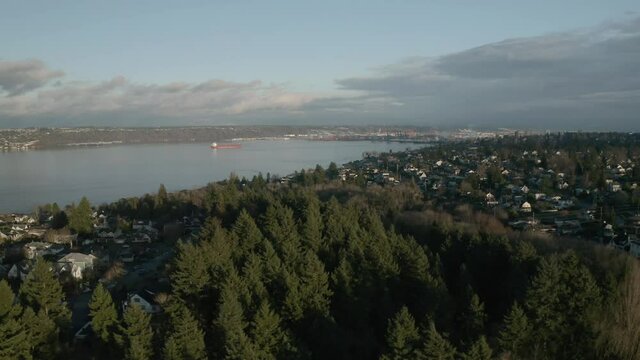 Overlooking Calm River With Scenery Of Townscape Surrounded By Lush Foliage In Proctor, City Of Tacoma. - Aerial Drone Shot
