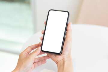 cell phone blank white screen mockup.woman hand holding texting using mobile on desk at office.background empty space for advertise.work people contact marketing business,technology