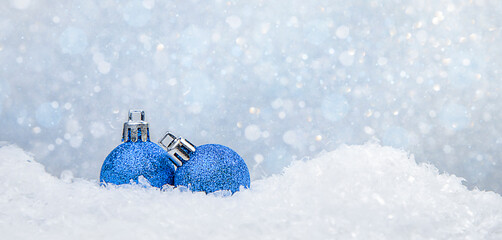 christmas card blue balls in the snow