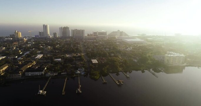 "Daytona Beach, FL USA - 12-10-2020: Cinematic parallax shot during the sunrise of the Daytona Beach skyline from over Halifax River."