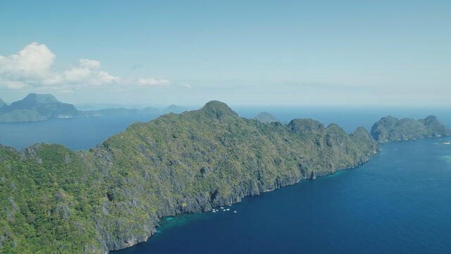 Blue Sea Bay At Mountain Islands Of Visayas Archipelago Aerial View. Nobody Nature Seascape With Deep Blue Water With Turquoise Shadows. Green Tropic Forest And Plants At Rock Coast Of El Nido Islets