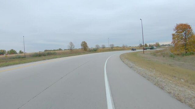 POV While Driving Around A Curve In Interstate I280 On A Cloudy Day In Early Winter Near Moline, Illinois; Approaching Exit Ramp For Interstates I74 To Peoria