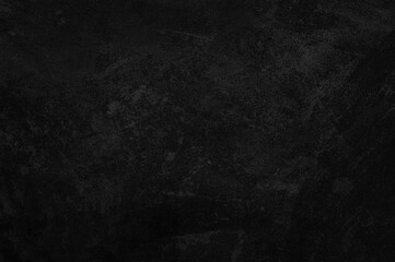 Dark concrete textured wall background.black grunge cement wall texture for interior design. dark edges.copy space for add text.