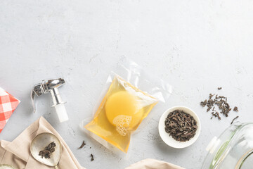 Kombucha in a package with ingredients for cooking. Fermented food.