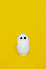 Creative easter card concept. Happy easter. White chicken egg with eyes. 