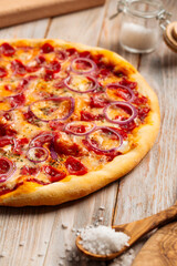 Closeup on hunter's sausage pizza on the wooden rustic table