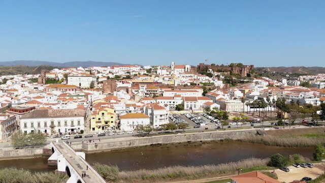 4k aerial drone footage above the historical town of Silves along the banks of the Arade River in Portugal.
