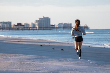 woman running on the beach