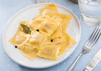 Delicious appetizing ravioli with bay leaf and black pepper. High quality photo