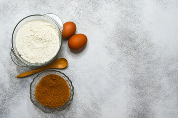 baking ingredients, eggs, flour and brown cane sugar, quarantine home baking concept, domestic life