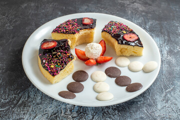 front view delicious cake slices with little cookies on dark background dessert biscuit sweet
