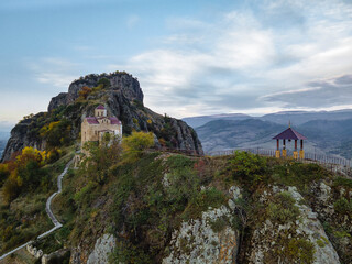 Shoanin christian temple. X century. Karachay-Cherkessia, Dombay, Russia. Mountain, outdoor. Drone shooting