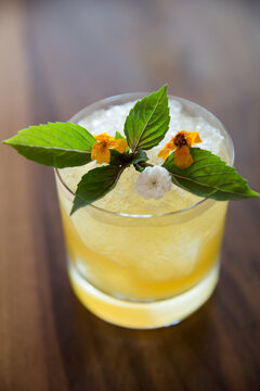 Cocktail drink with mint garnish.