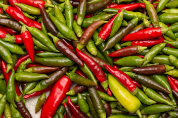 chili peppers green and red as background