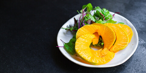 pumpkin salad snack green leaves lettuce, vegetable on the table healthy meal  top view copy space for text food background rustic 