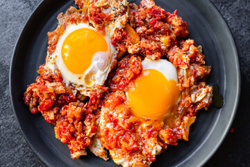breakfast eggs fried tomato, onion and vegetables shakshuka omelette natural snack on the table healthy meal snack top view copy space for text food background rustic 