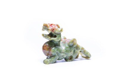Jade stone sculpture Pixiu Dragon Feng Shui is Chinese lucky animal isolated on white background.