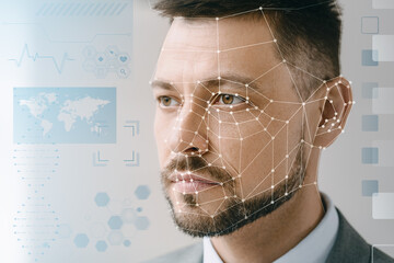 Man with face scanning on light background