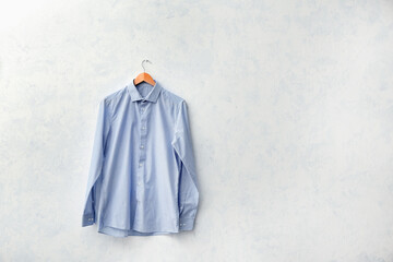 Stylish male shirt on light background