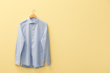Stylish male shirt on color background