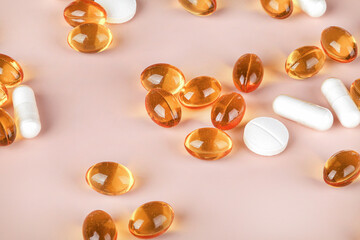 Variety of vitamin pills on beige background, supplemental and healthcare product, Including vitamin D3, zinc.