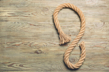 Obraz premium Rope on wooden background, closeup