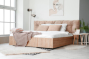 Blurred interior of modern stylish bedroom