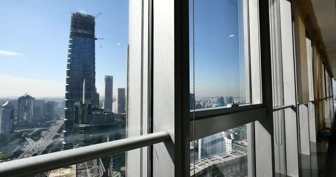4k,Aerial View of heavy traffic through BeiJing central business district from window,that is located in the Chaoyang district,It's the main hub for financial and business activities in China's capita