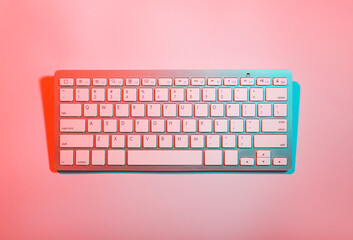 Computer keyboard on color background