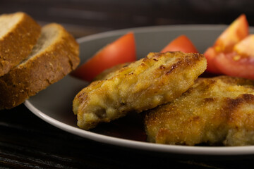 Pork fried in breadcrumbs and bread