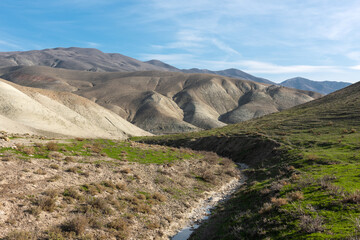 A small dry river in a mountainous desert area