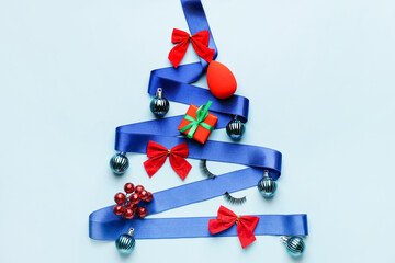 Beautiful Christmas tree made of decor, sponge and ribbon on color background