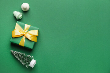 Christmas decor and makeup sponges on color background