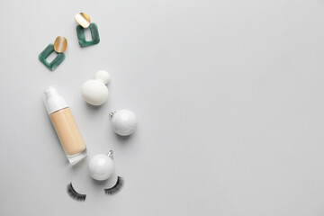 Christmas composition with cosmetics on white background