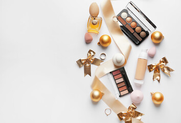 Christmas composition with cosmetics on white background