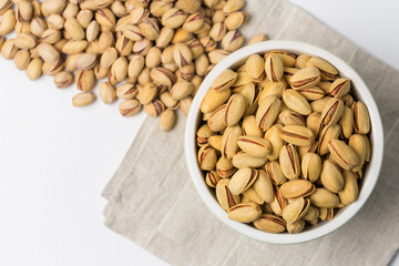 Pistachio nuts on a white background in studio