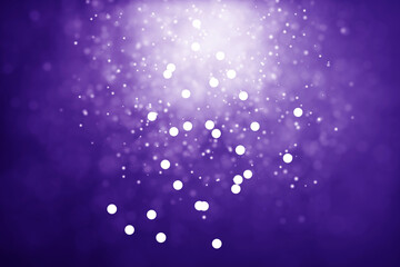 Abstract blue blurred bokeh light on dark background. New Year holiday card template. Magic falling snow backdrop.