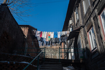 Clothes are drying on a rope outside.